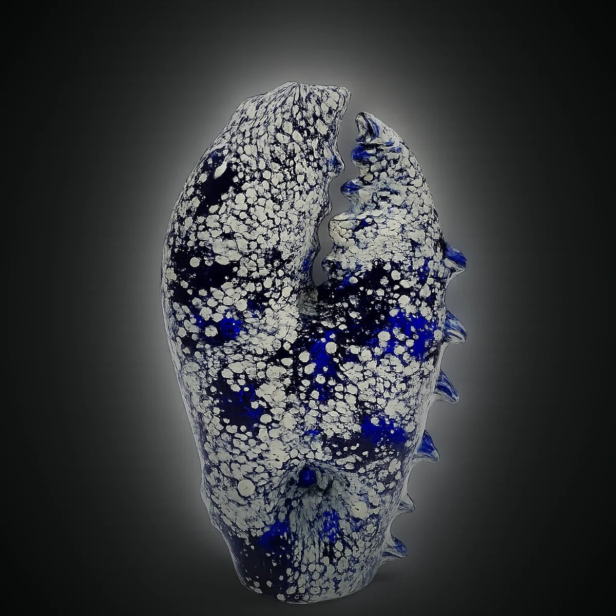 Abyss Claw, a hand-blown sculpted glass hand pipe in cobalt and bone white
